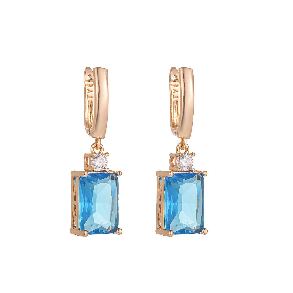 Square geometric copper earrings with electroplated gold finish and quadrilateral design elements