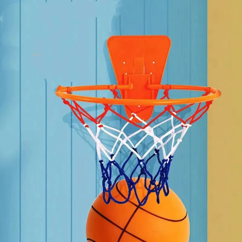 Silent foam basketball training ball in assorted bright colours with basketball hoop
