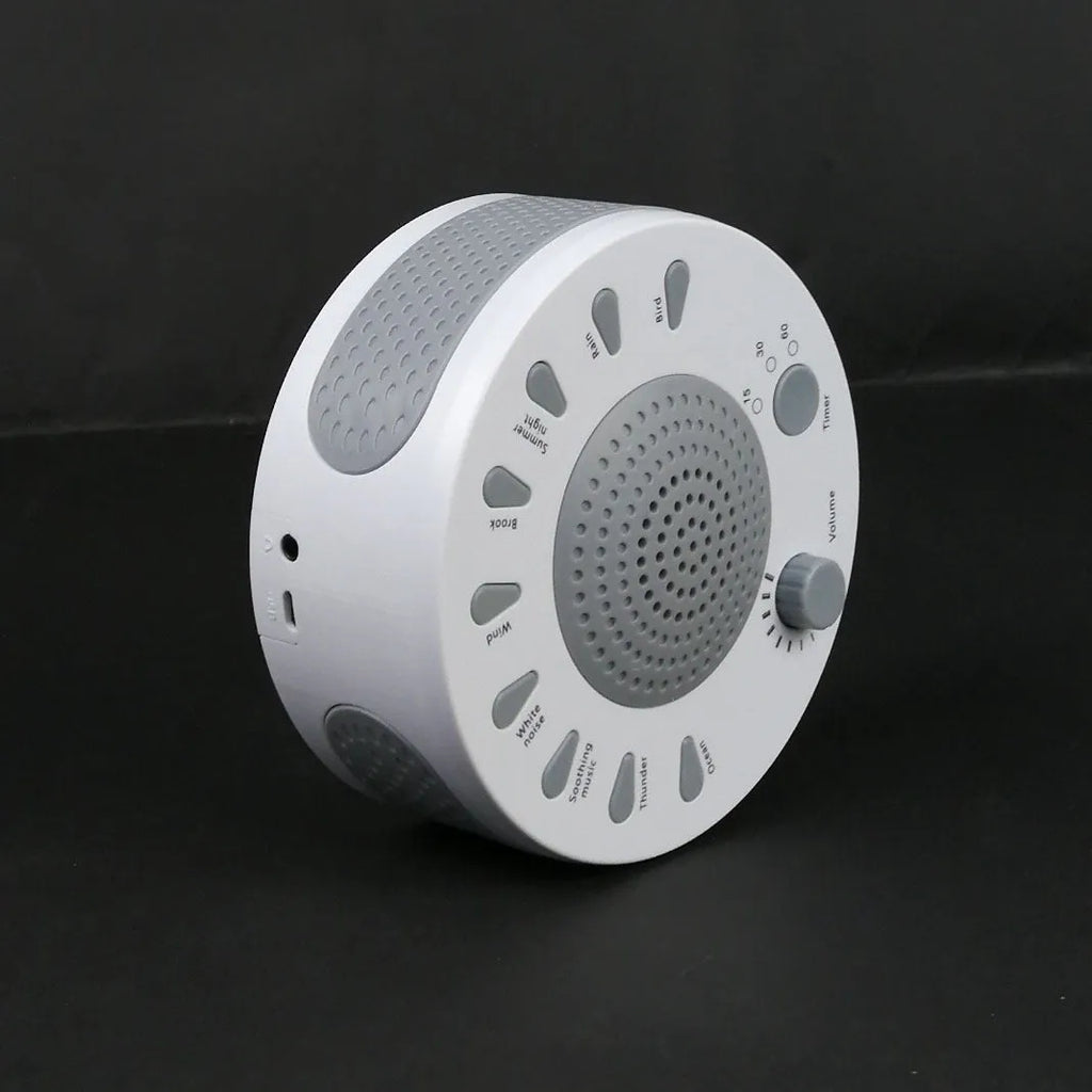 White noise sleep instrument with volume knob and multiple sound options in compact packaging