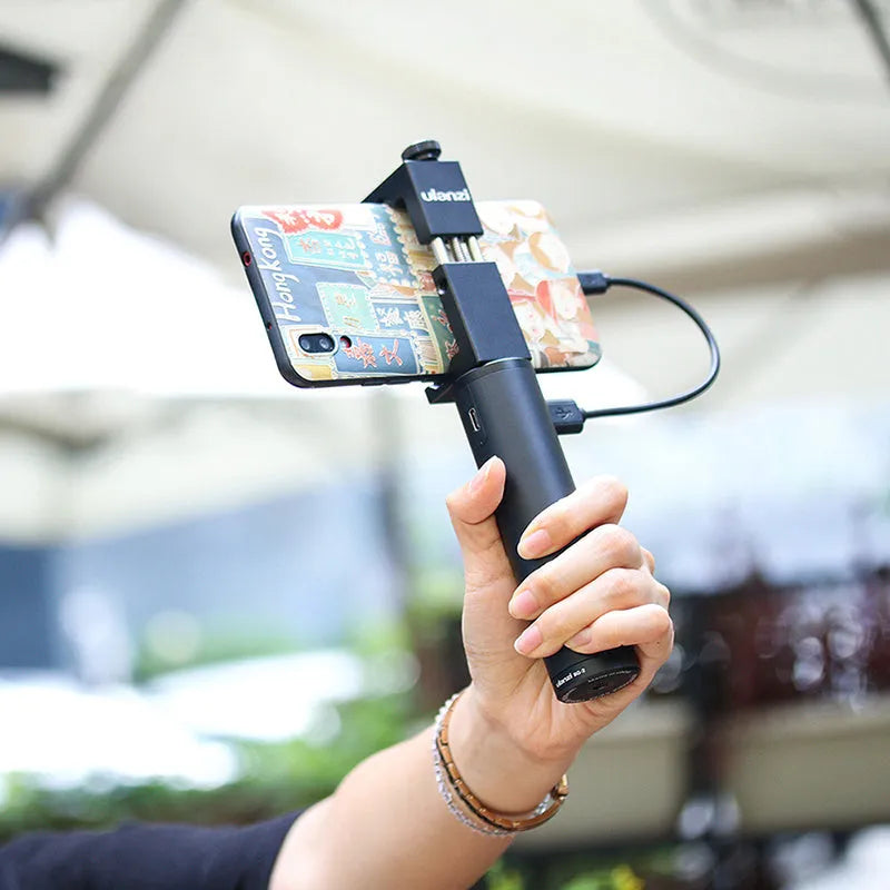 Black aluminium alloy portable power bank with a carry handle showing size of 12.5cm