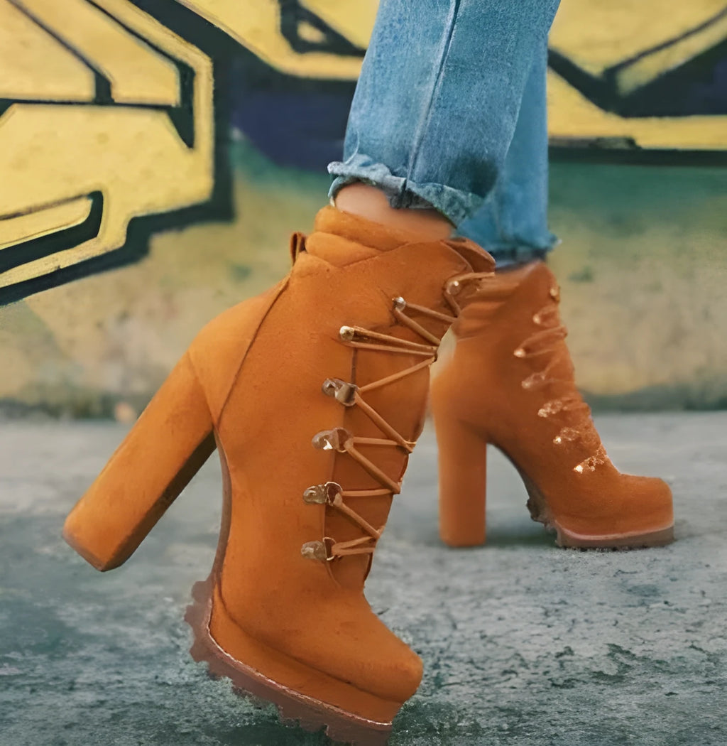 Women's suede ankle boots with a thick high heel and platform sole in four colour choices.
