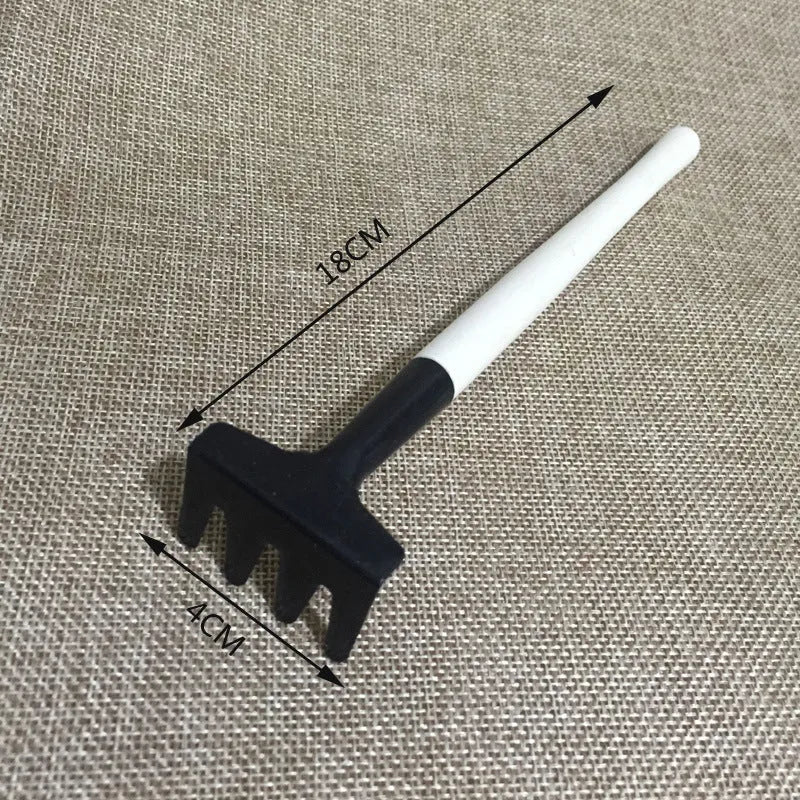 14-piece plastic succulent gardening tool set showing drip kettle, mini shovels, tweezers, and brush on a table.