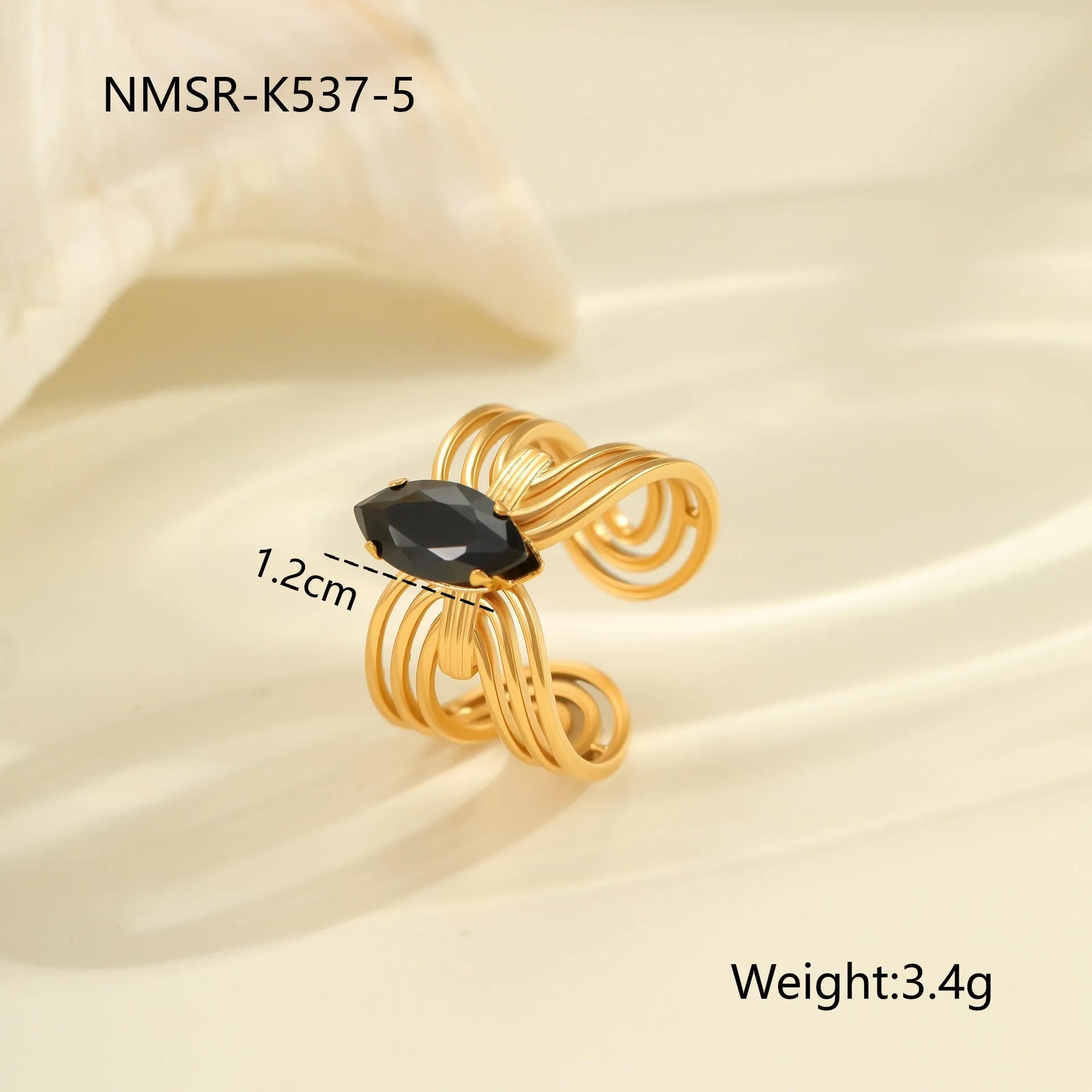 Geometric open mouth titanium steel ring for women on a plain background.