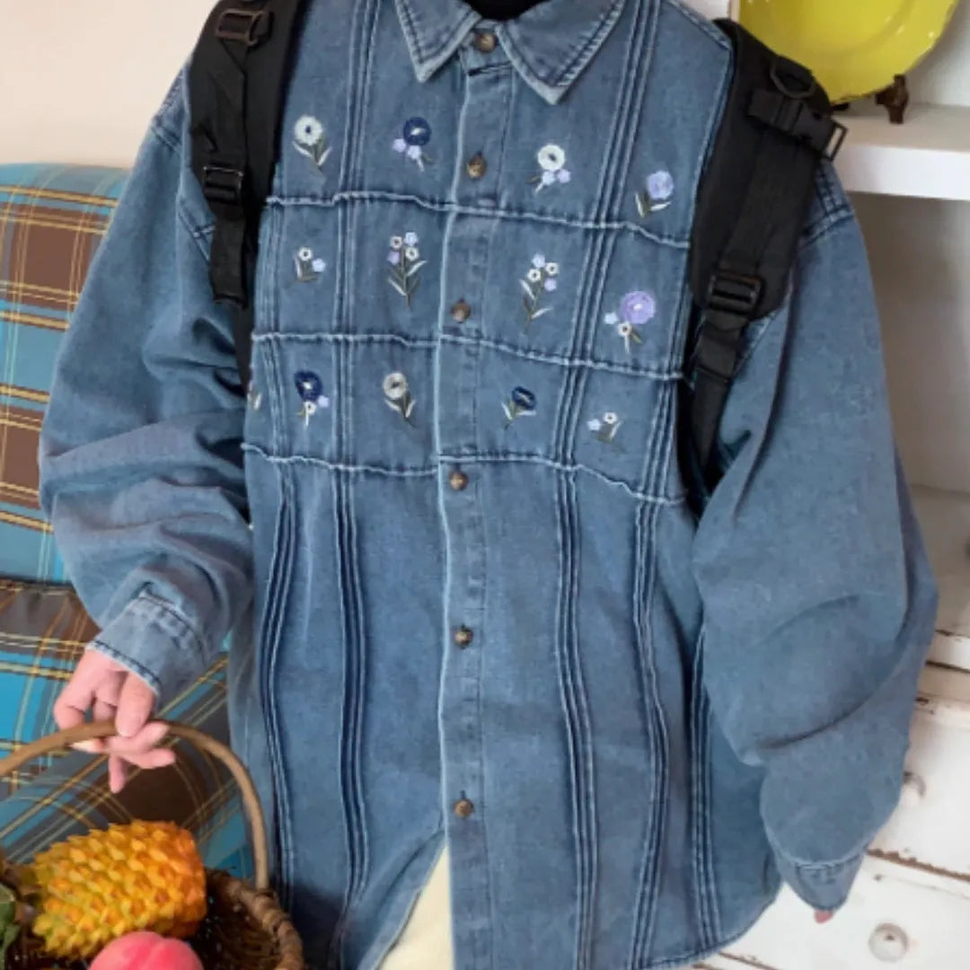Washed blue denim long sleeve shirt with vintage small floral pleat details on the front.