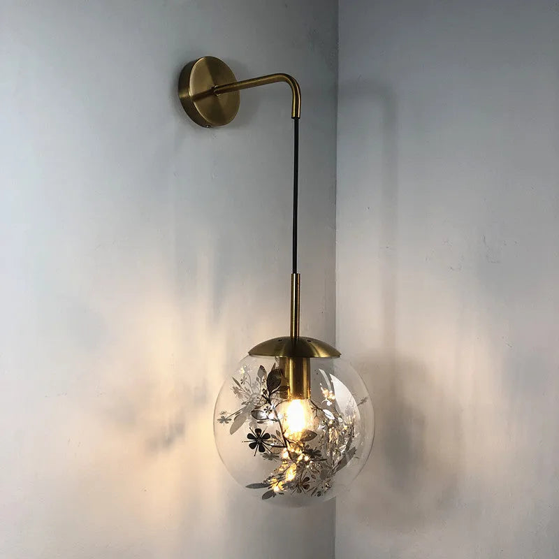 Modern glass wall lamp in golden flower or silver flower finish, shown in 15cm and 20cm sizes