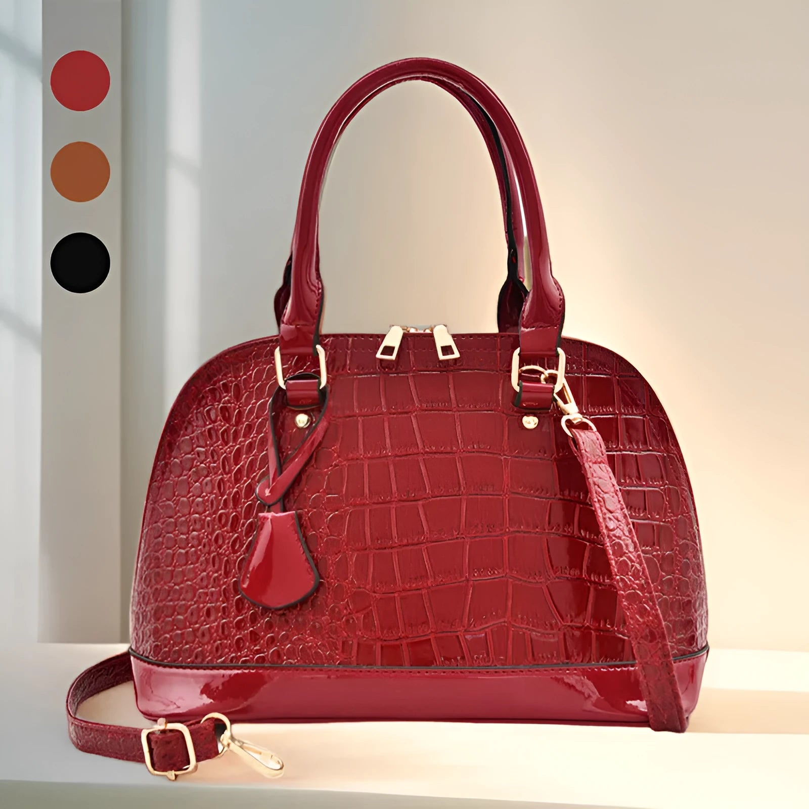 Large black structured shell-shaped crossbody shoulder bag with shoulder strap