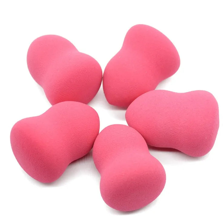 Pink hydrophilic non-latex makeup foundation sponge on a white background.