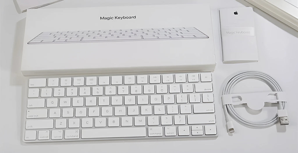 White Apple ultra-thin metal Bluetooth G6 wireless keyboard on a desk.