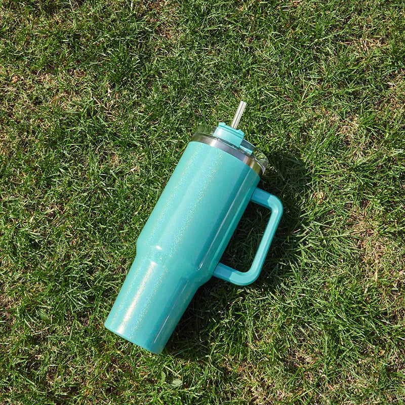 Large stainless steel vacuum insulated cup in a gradient colour option showing its height and simple style.