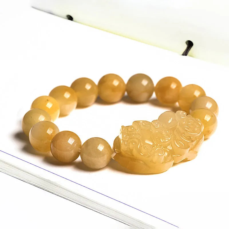 Carved Jinsi Jade money bracelet showing golden thread patterns in natural stone