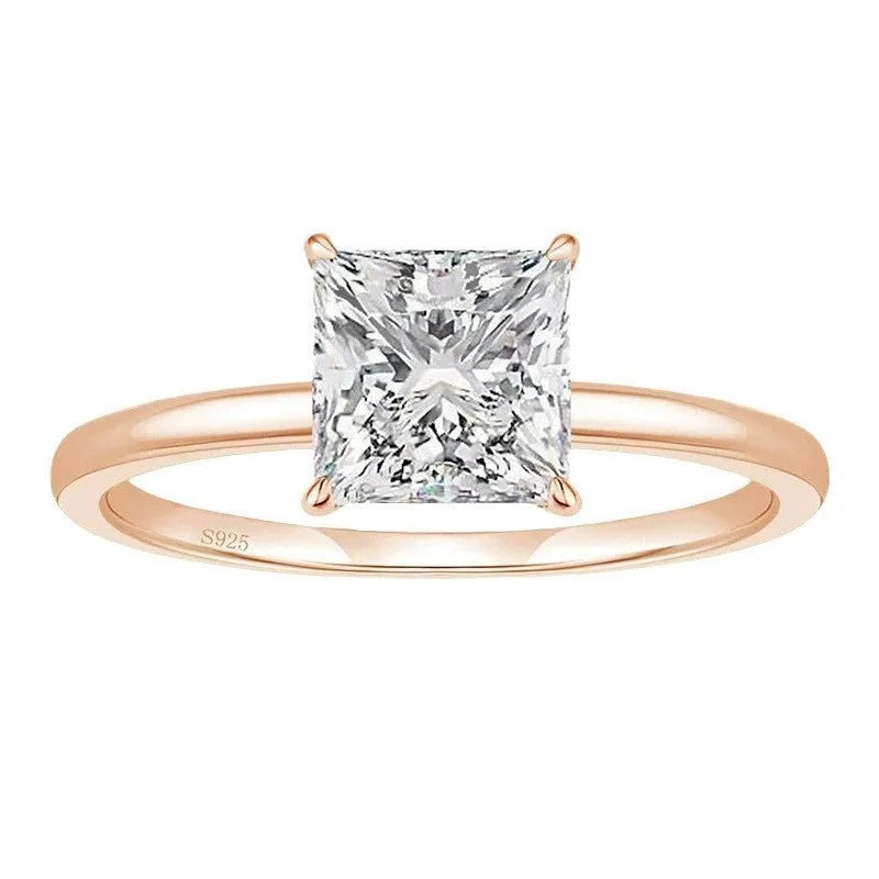 Simple geometric 925 silver ring for women in gold, rose gold, or silver colour on a grey background.