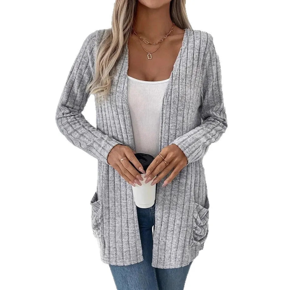 Women's loose-fit long sleeve cardigan with pockets in granny grey, shown on a hanger.