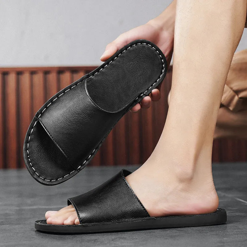 Men's brown and black leather sandals with a rubber sole for casual outdoor wear.