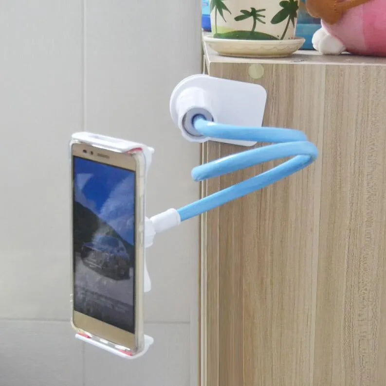 Black adjustable bedside phone holder with long arm on a table