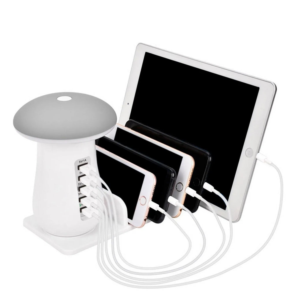 White mushroom-shaped USB charging dock station with five ports and a glowing LED light on a desk.