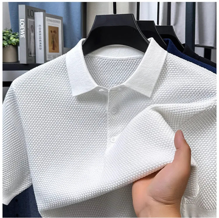 Loose fitting short sleeve cotton sweater in a neutral colour, showing pullover style and casual fit.