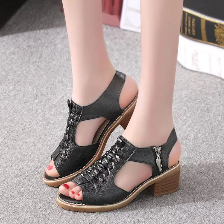 Women's retro sandals with side zip closure and a medium heel in creamy white.