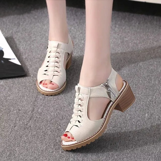 Women's retro sandals with side zip closure and a medium heel in creamy white.