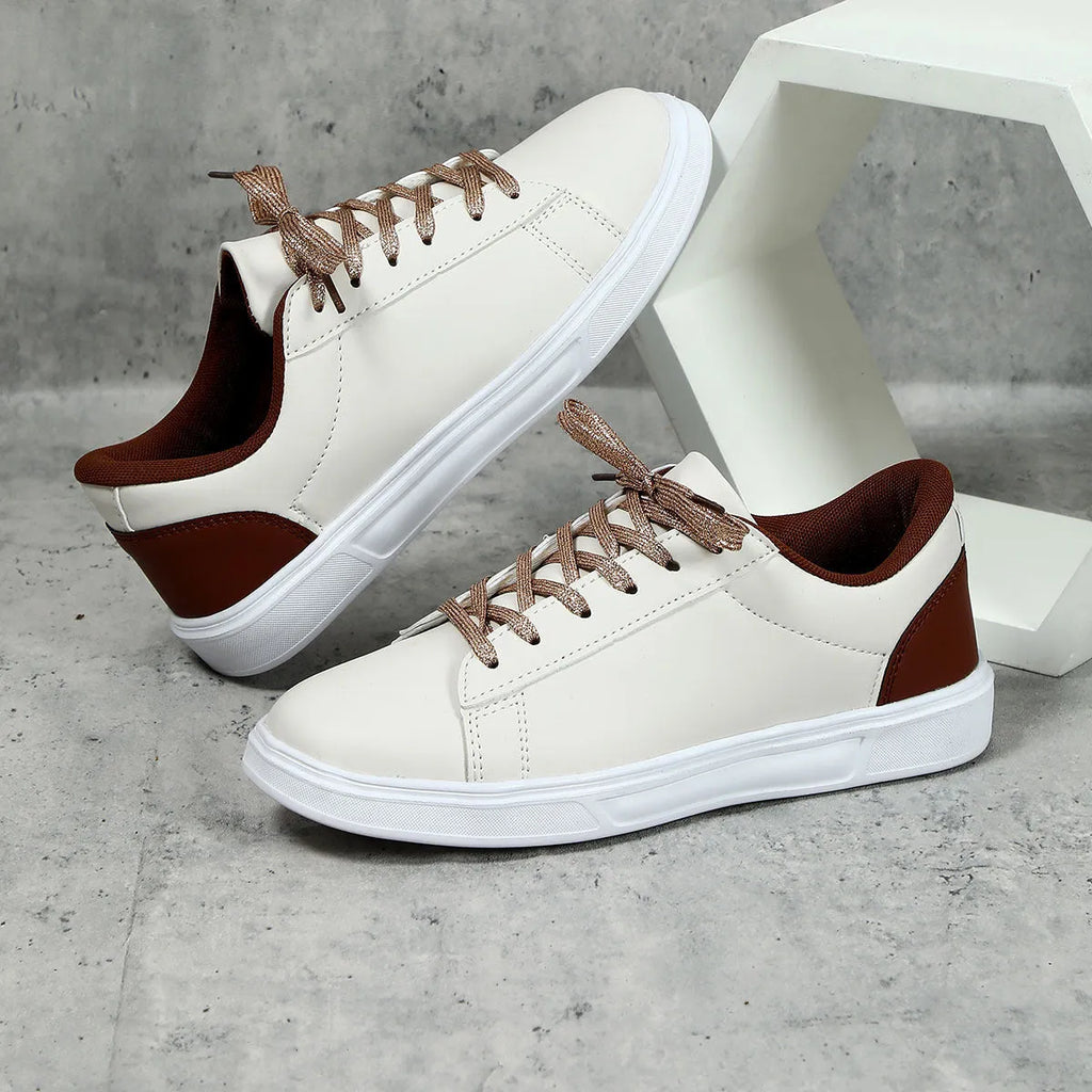 Low-top platform skate shoes with cross-strap detail and mid-heel design in beige brown colour