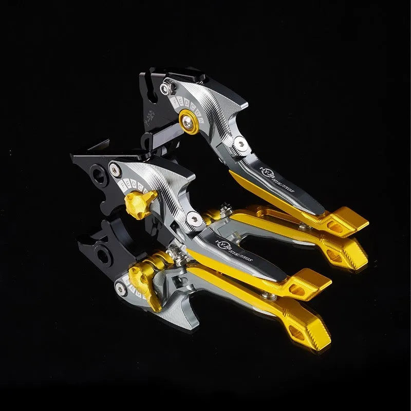 Pair of anodised metal motorcycle brake and clutch levers with adjustable length mechanism