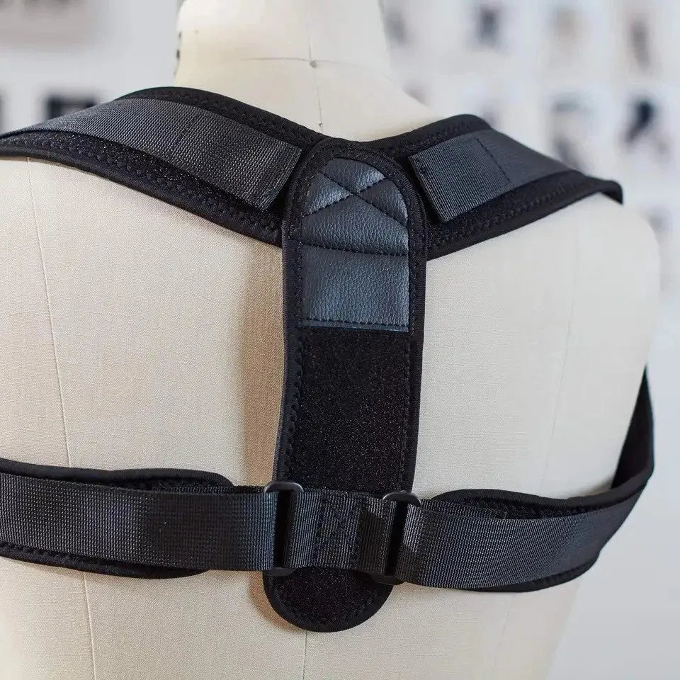 Black adjustable breathable posture correction strap laid flat.