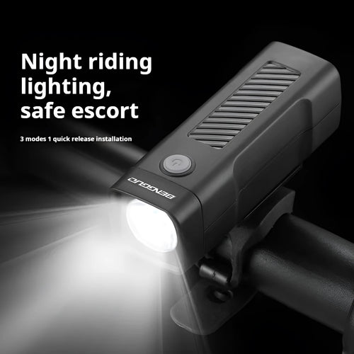 A black USB-rechargeable bicycle headlight mounted on a handlebar with a quick-release strap.