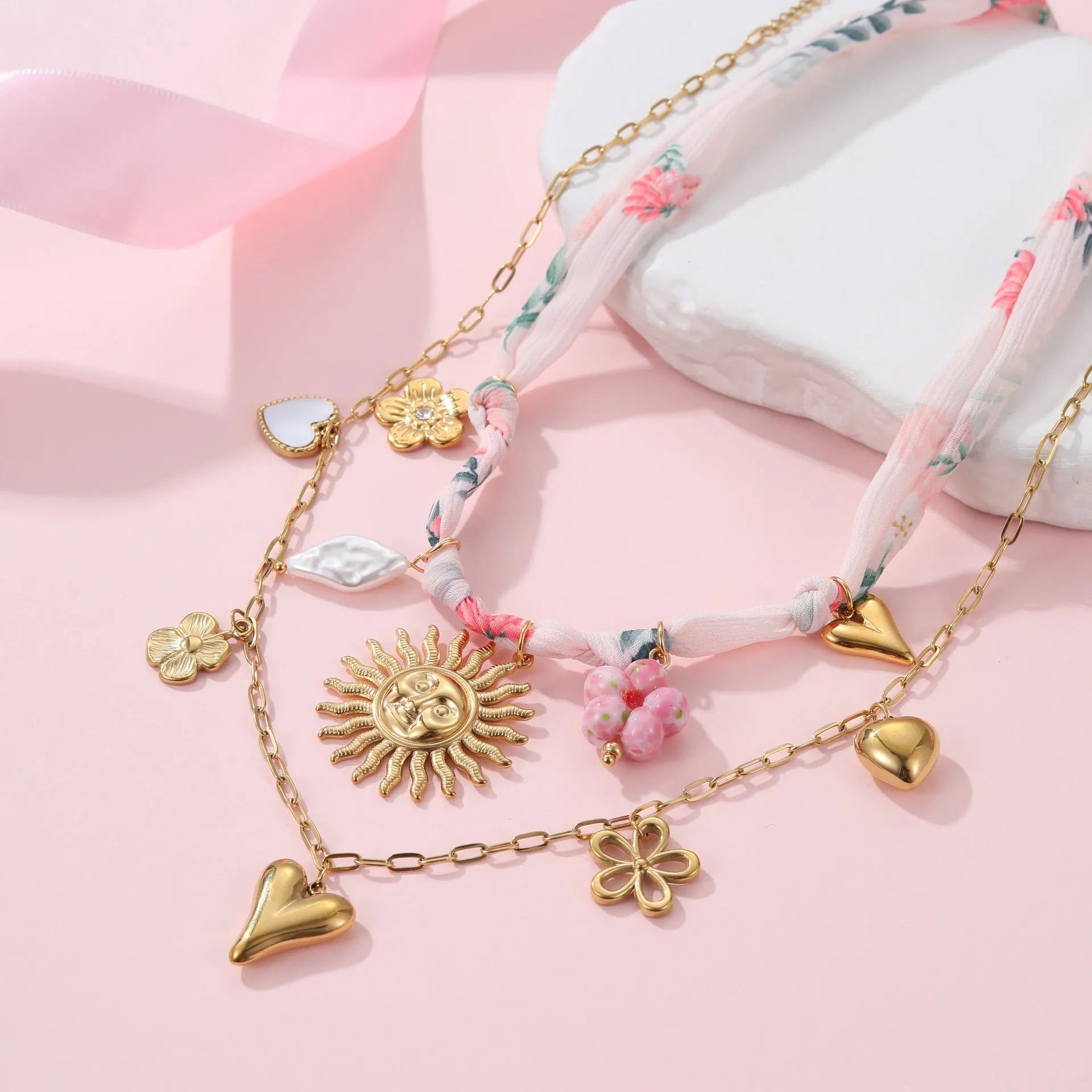 Stainless steel geometric sun pendant necklace with 18K gold electroplated finish on 41-50cm chain