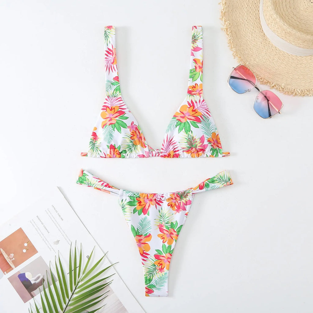 Women's floral printed bikini swimsuit two-piece set in blue on a mannequin.