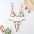 Women's floral printed bikini swimsuit two-piece set in blue on a mannequin.