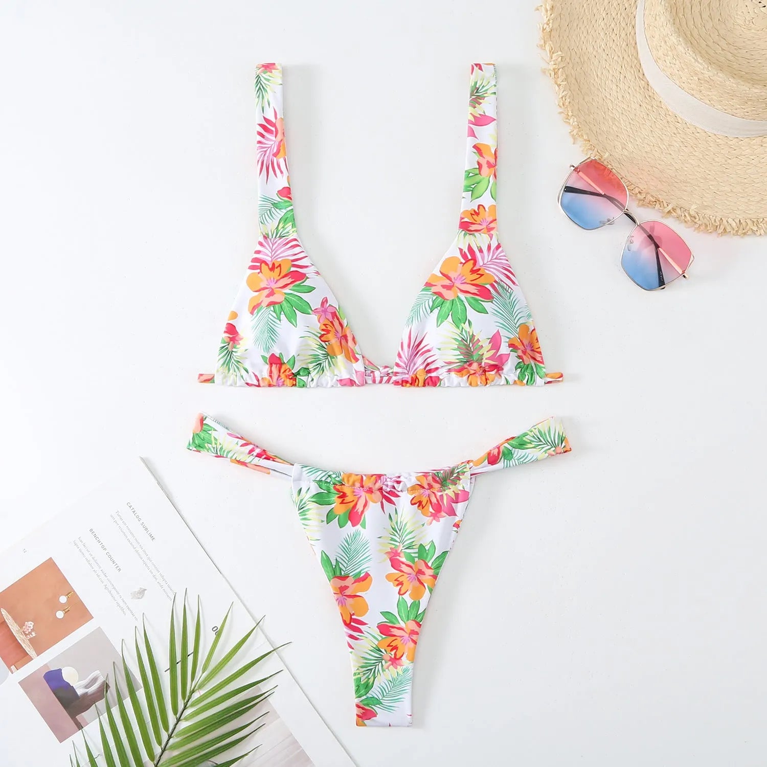 Women's floral printed bikini swimsuit two-piece set in blue on a mannequin.