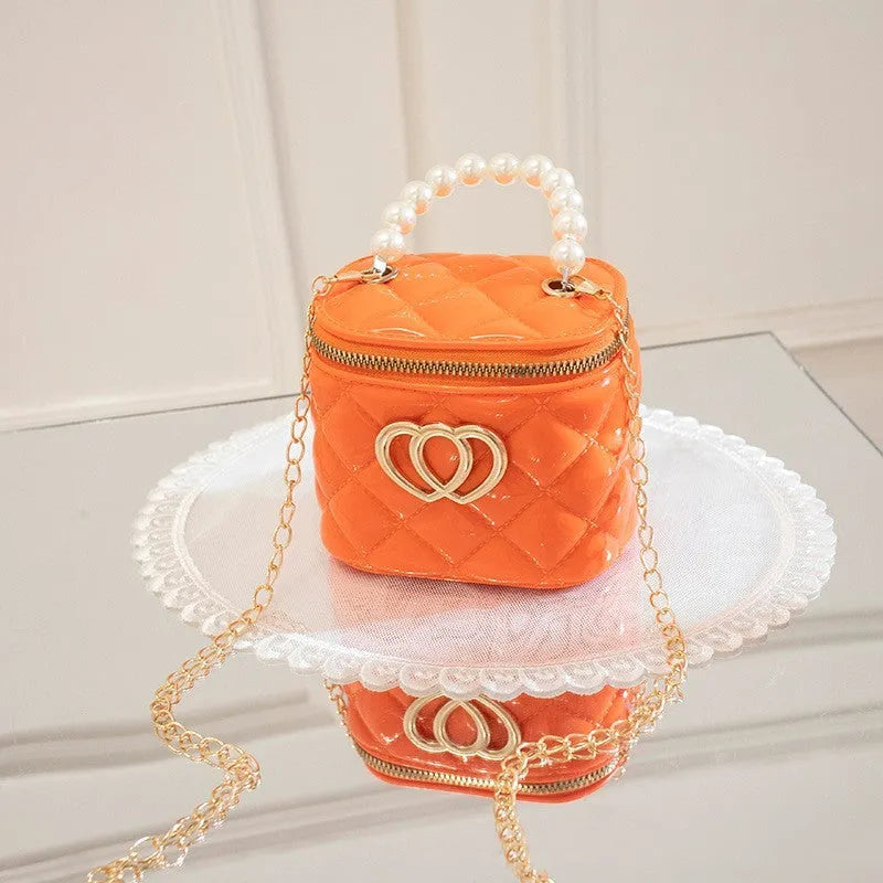 PVC bucket-shaped gel bag with a heart pattern, shown in one of seven available colours.