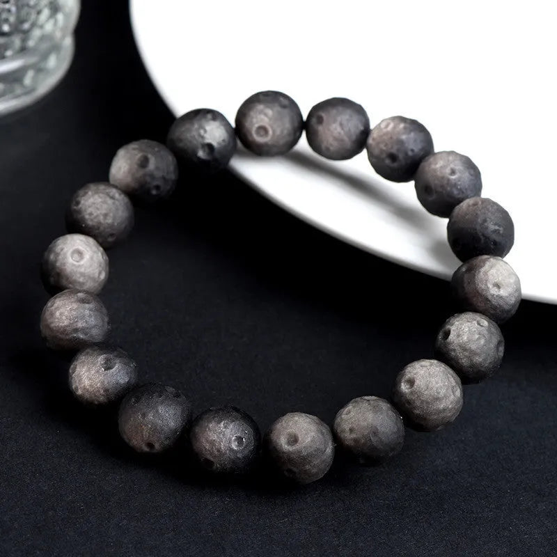 Natural crater ball bracelet featuring gold obsidian and silver stone meteorite beads in various sizes from 9mm to 16mm