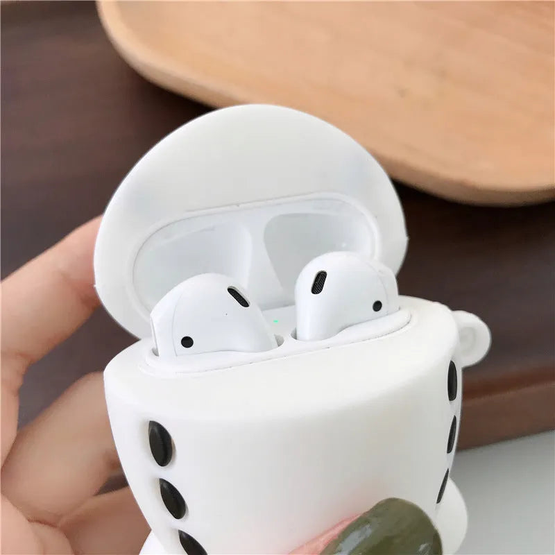Cartoon aircraft headset design silicone flip case for Apple AirPods 1 and 2 with a metal carrying hook.