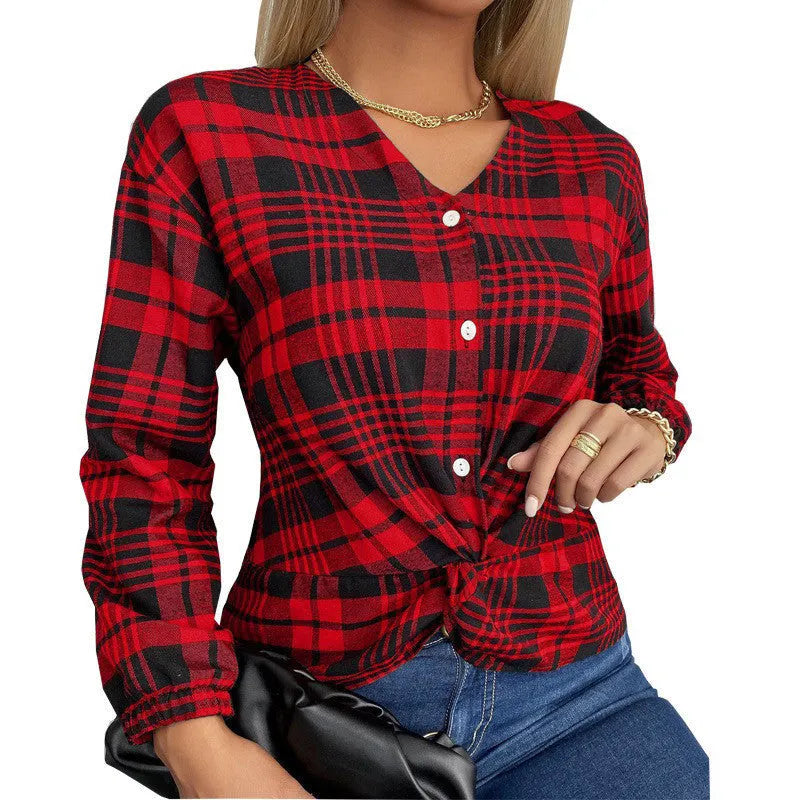 Women's purple loose fit plaid shirt with regular sleeves on a hanger.