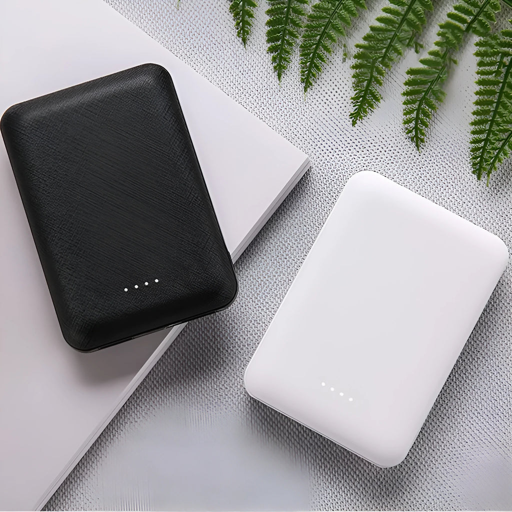 Black or white ultra-thin 10000mAh power bank with multiple USB ports, dimensions 90x63x22mm.