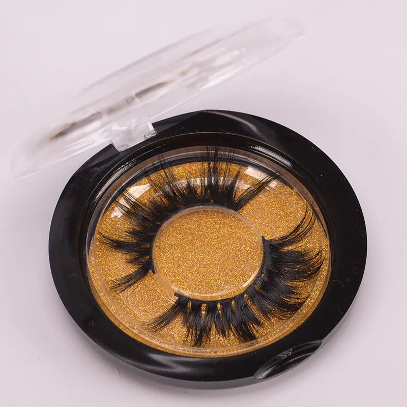 5D mink false eyelashes set with brush and storage cap on pink background