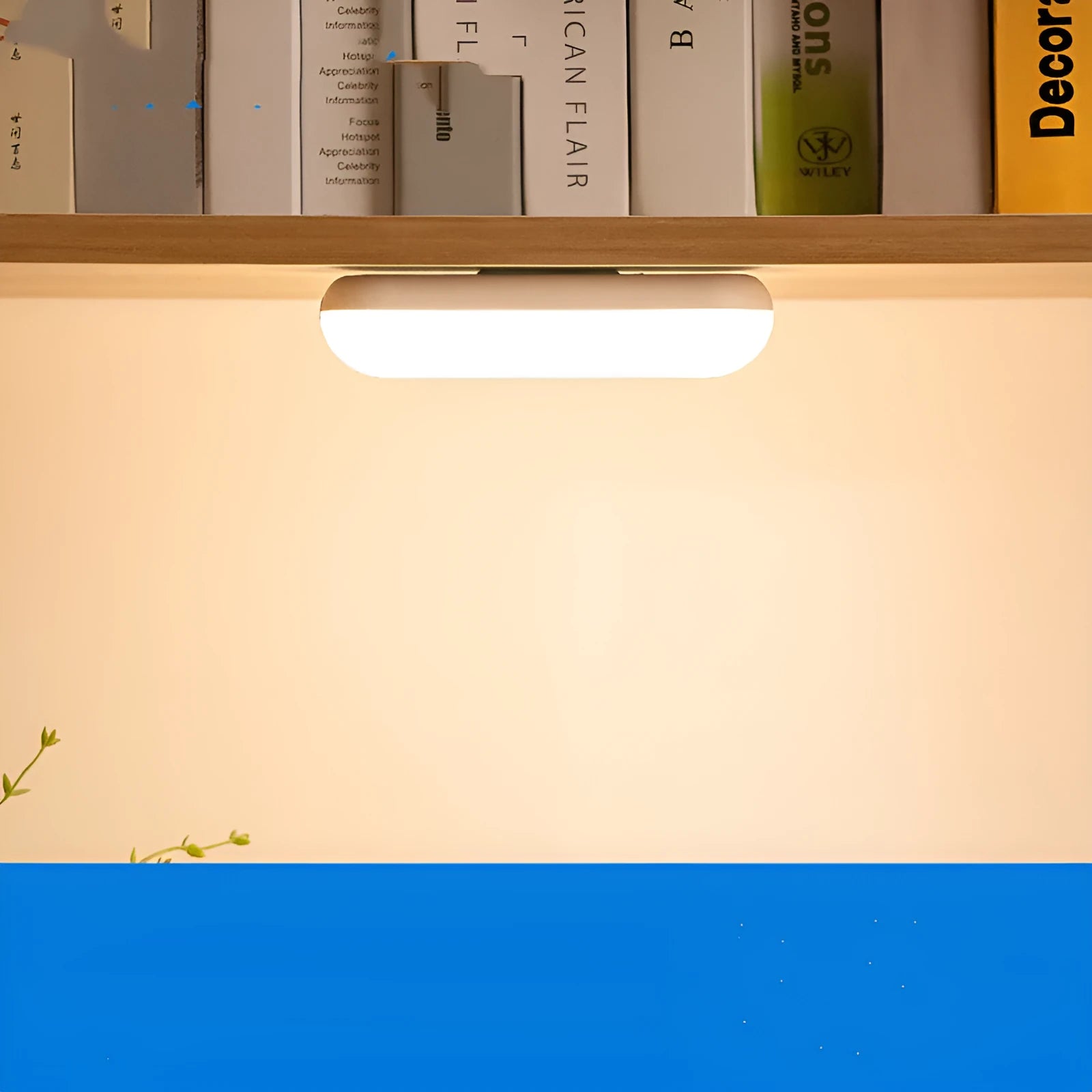 Compact white magnetic table lamp with a large luminous surface and USB charging port.