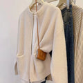 Beige soft glutinous sweater coat cardigan with long sleeves on hanger