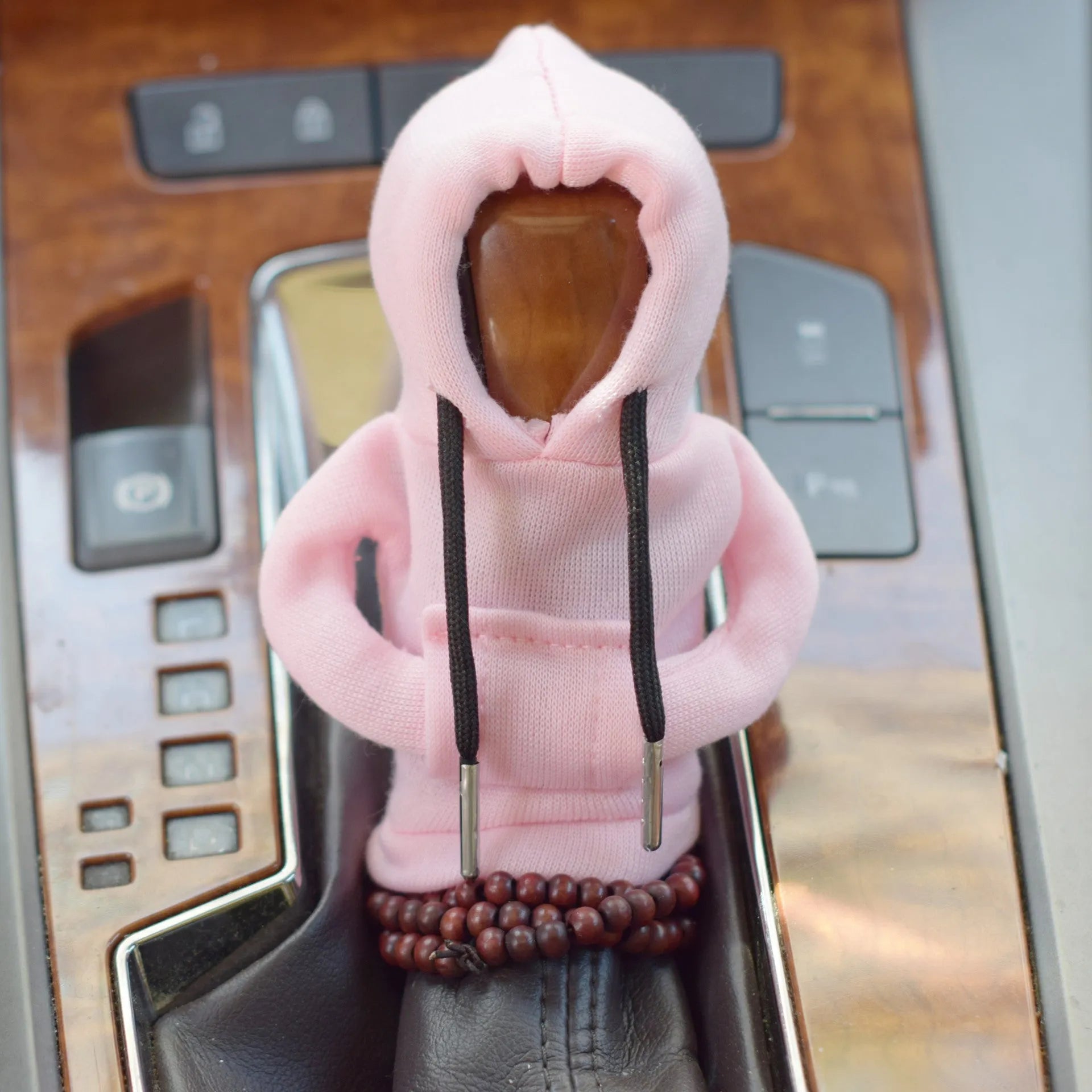 Soft Dutch velvet car gear handle cover in multiple colours on a gear stick.