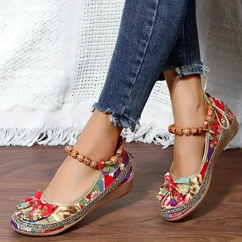Women's black ethnic style platform sandals with elastic band closure, fabric upper, and round toe.