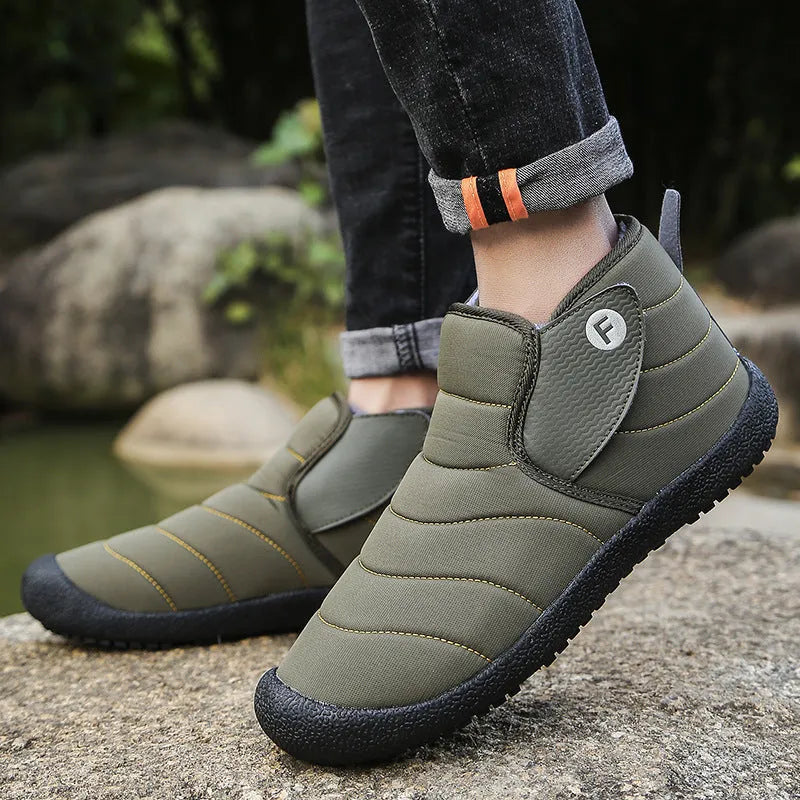 Men's waterproof snow boots in black with thick cotton upper and rubber sole.