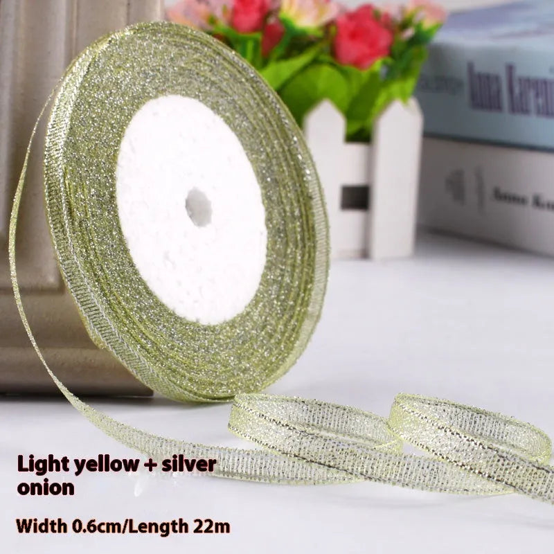 Roll of polyester gift ribbon showing 0.6cm width and multiple colour options including metallic finishes