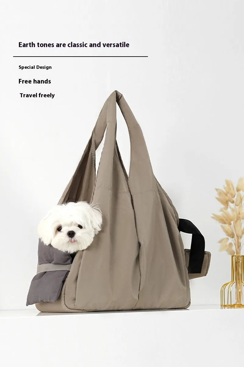 Apricot coloured cloth pet carrier handbag showing breathable fabric and portable design