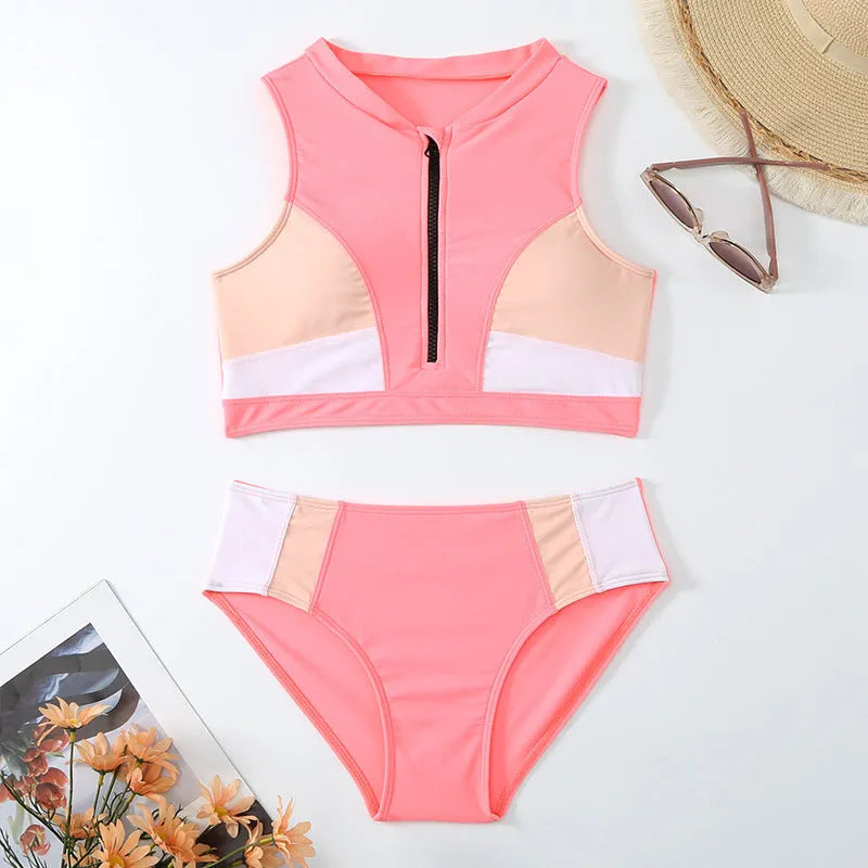 Pink high waist bikini swimsuit with brief style bottoms on a mannequin