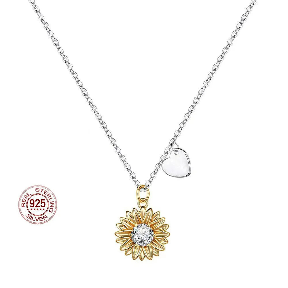 Sterling silver sunflower necklace with adjustable chain on white background