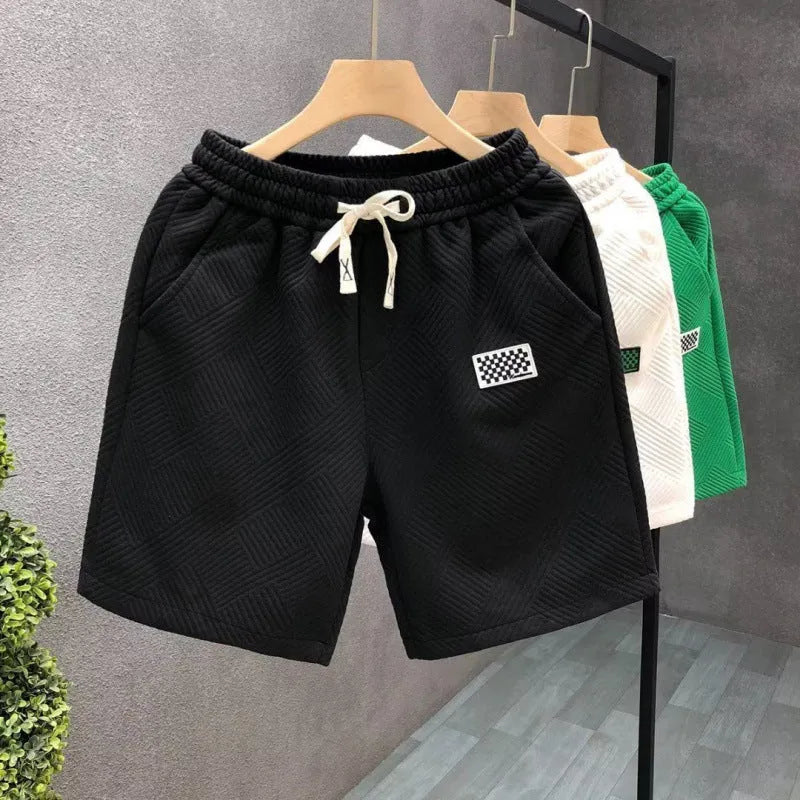 Men's casual sports shorts in polyester micro-elastic fabric available in white, black, or green