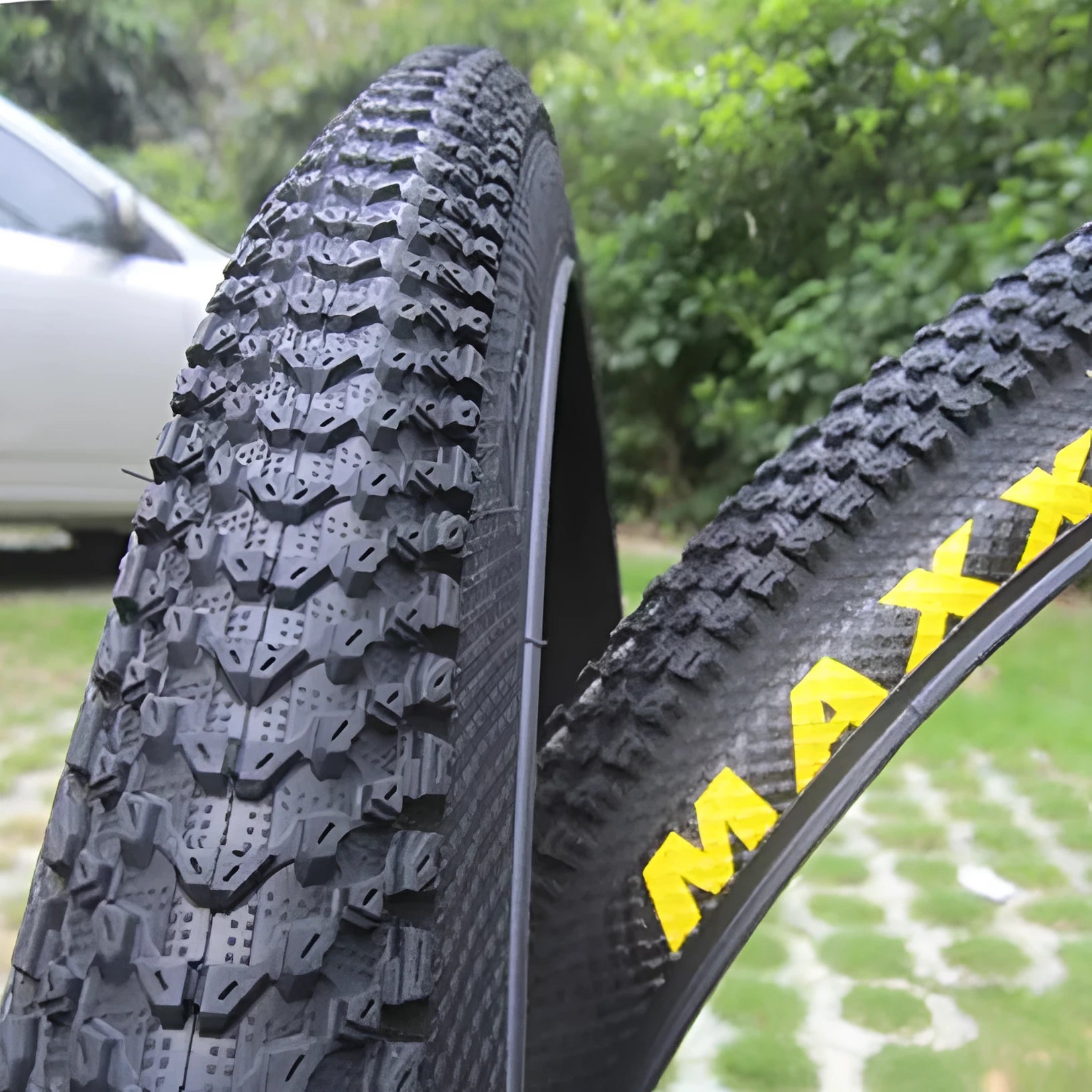 Ultralight puncture resistant mountain bike tyre shown in multiple sizes including 26, 27.5, and 29 inch diameters.