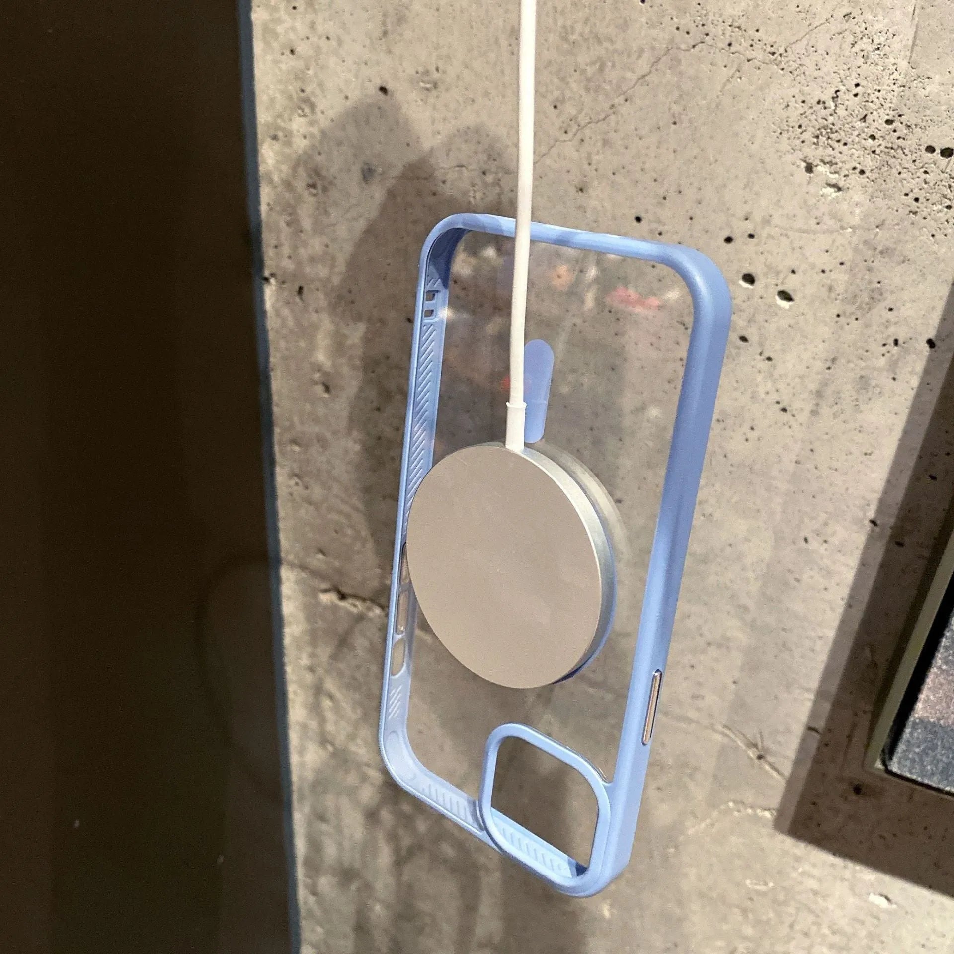 Transparent acrylic MagSafe phone case for iPhone showing magnetic ring and clear design