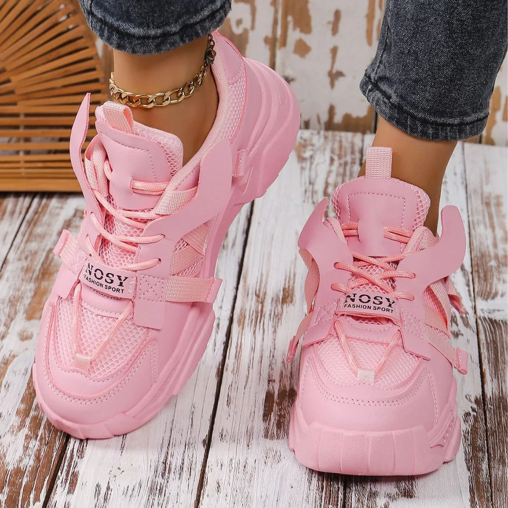 Women's purple platform mesh sports shoe with lace-up front and thick sole for height increase.
