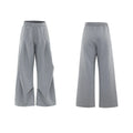 Men's dark grey cotton sports suit with metal embellishments, V-neck padded shoulders, short sleeves, and matching shorts